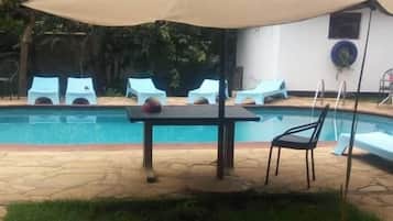 Outdoor pool, pool umbrellas, sun loungers
