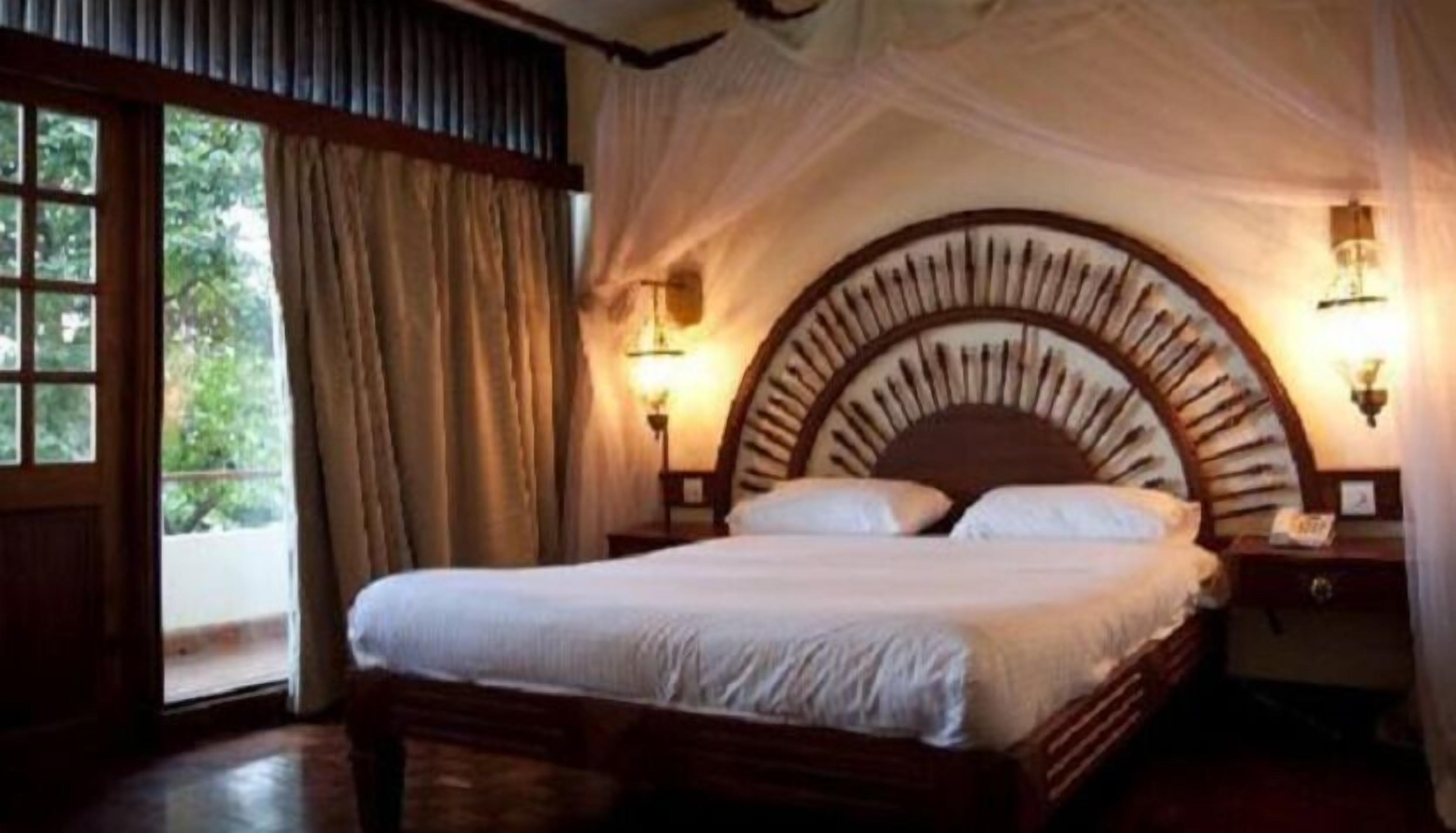 Double Room | Desk, blackout drapes, iron/ironing board, cribs/infant beds