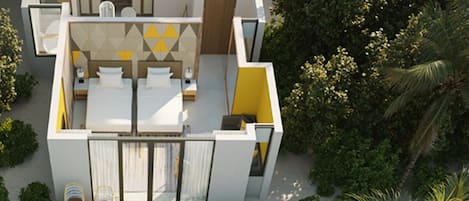 Una villa frente al mar con piscina, mobiliario exterior y abundante vegetación.