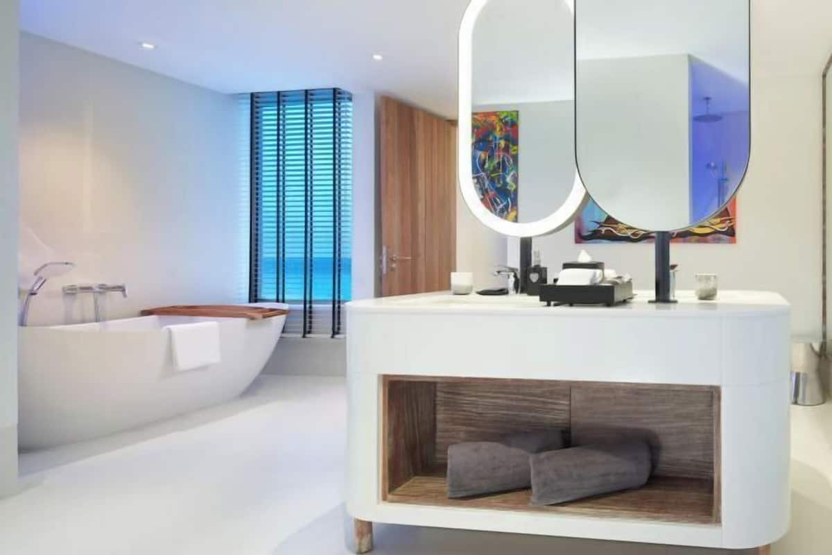 Bathroom | Designer toiletries, hair dryer, bathrobes, slippers
