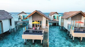 Overwater bungalows with infinity pools, wooden walkways, and thatched roofs. - Hard Rock Hotel Maldives - FREE shared speedboat for stays from 01st Mar to 21st Dec 2026 (Emboodhoo Lagoon)