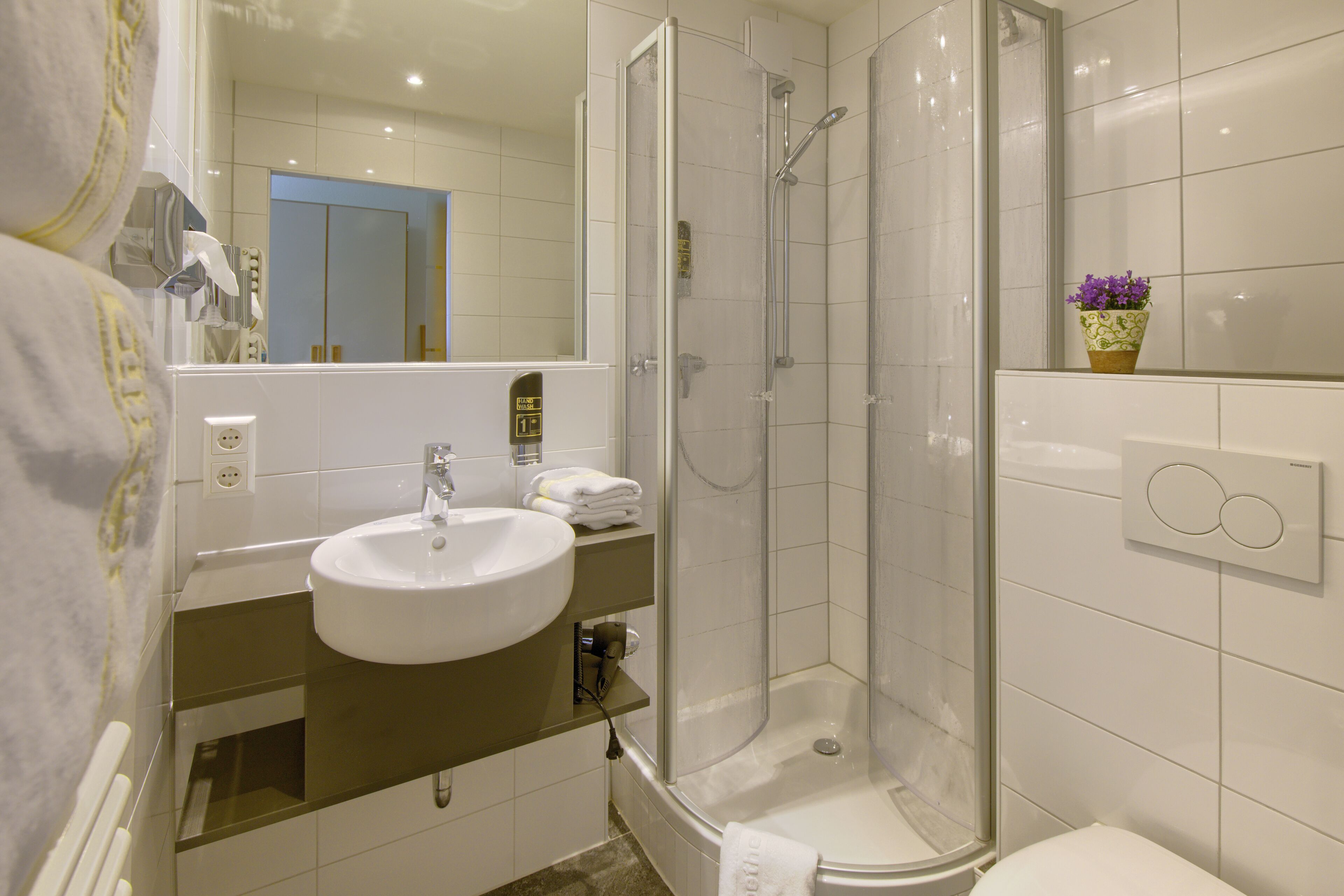 shower, free toiletries, hair dryer, towels