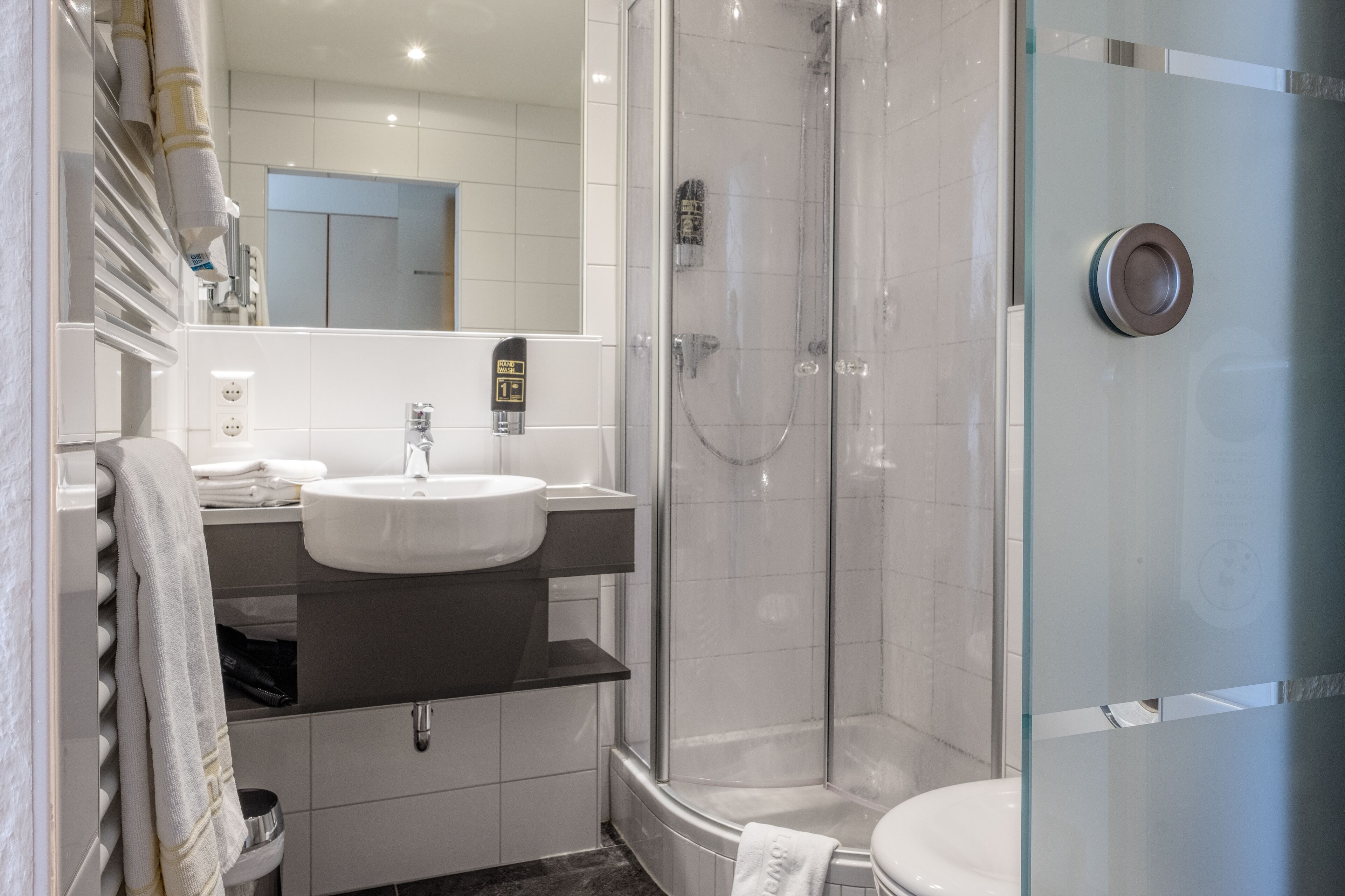 shower, free toiletries, hair dryer, towels