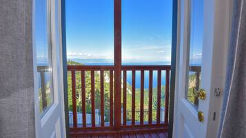 Double Room, Balcony, Sea View | Minibar, in-room safe, desk, blackout drapes