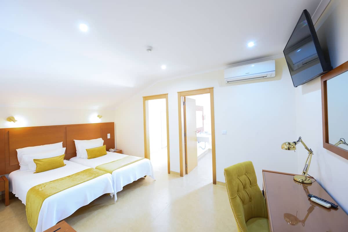 Premium bedding, down duvets, minibar, in-room safe