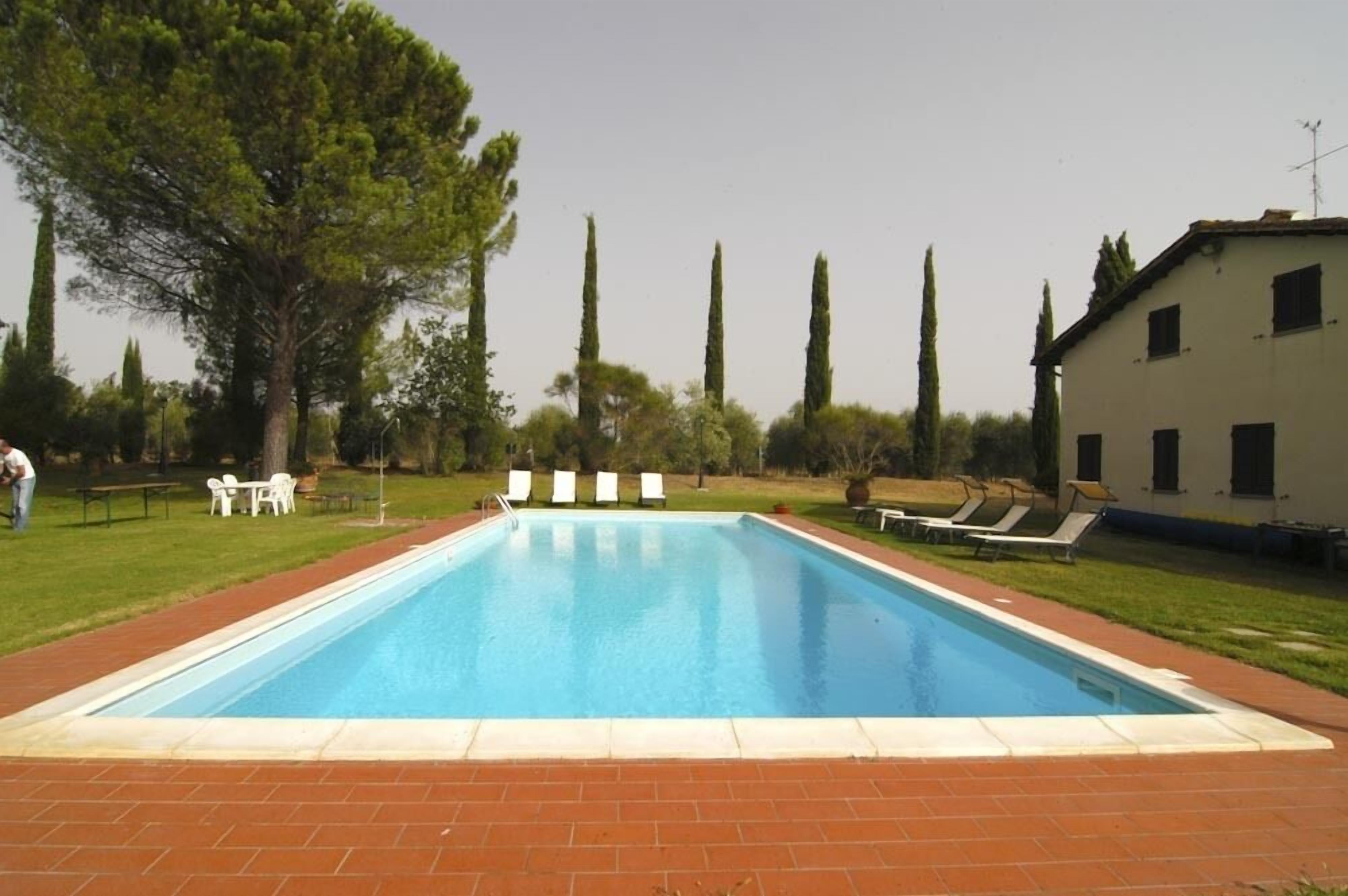Seasonal outdoor pool, pool umbrellas, pool loungers