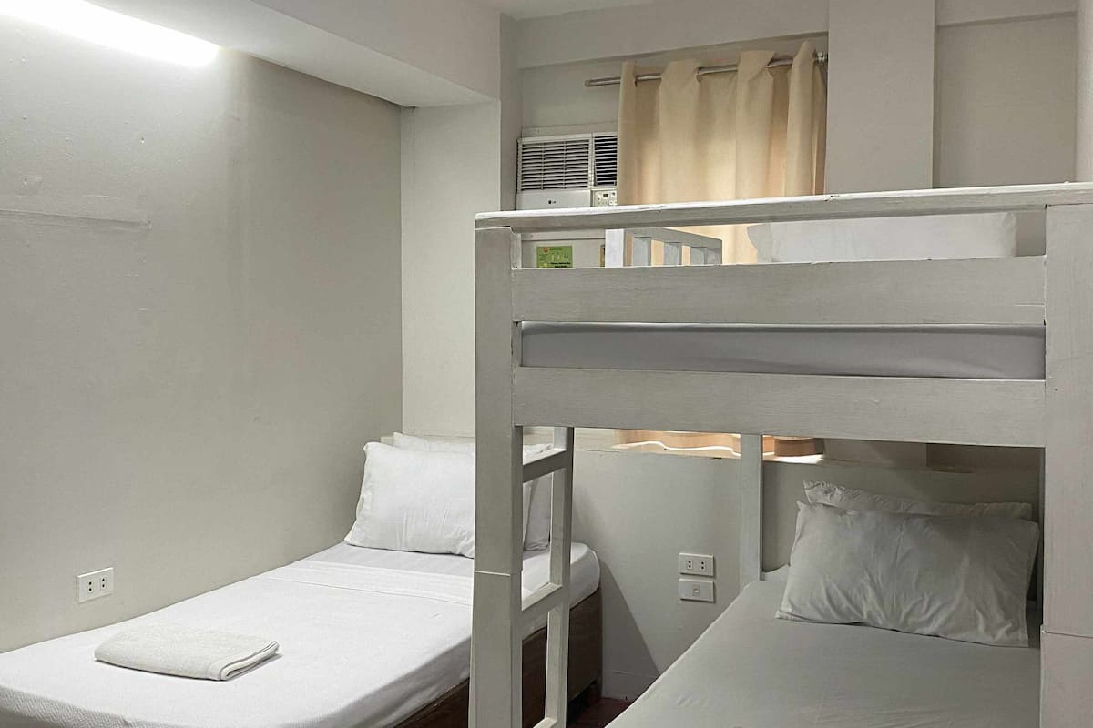 Family Triple Room | Desk, iron/ironing board, bed sheets
