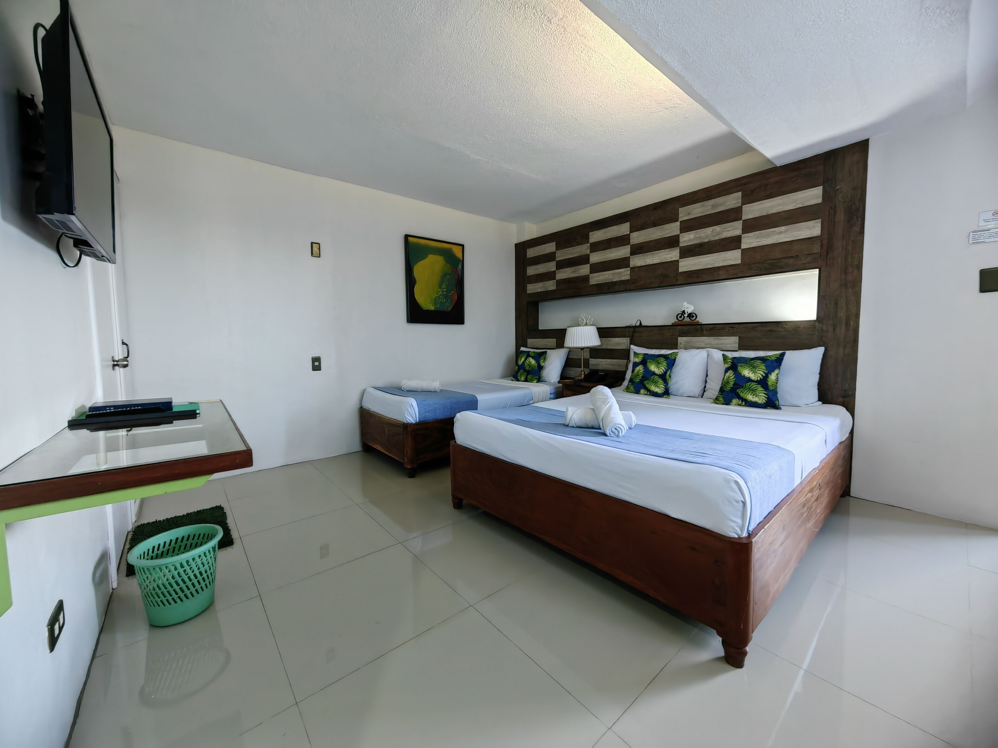 Desk, iron/ironing board, bed sheets