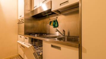 Apartment, 3 Bedrooms | Private kitchen | Coffee/tea maker, full-sized fridge, oven, stovetop