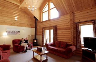 Signature Chalet, 3 Bedrooms, Accessible, Sauna | Living room | 42-inch LED TV with satellite channels, TV, DVD player