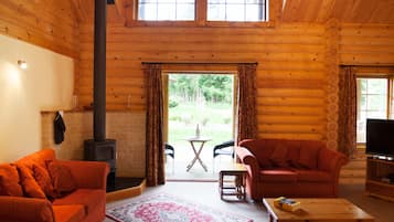 Signature Chalet, 3 Bedrooms, Accessible, Sauna | Living room | 42-inch LED TV with satellite channels, TV, DVD player
