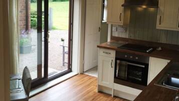 Exclusive Apartment, Ground Floor | Private kitchen | Full-size fridge, microwave, oven, stovetop