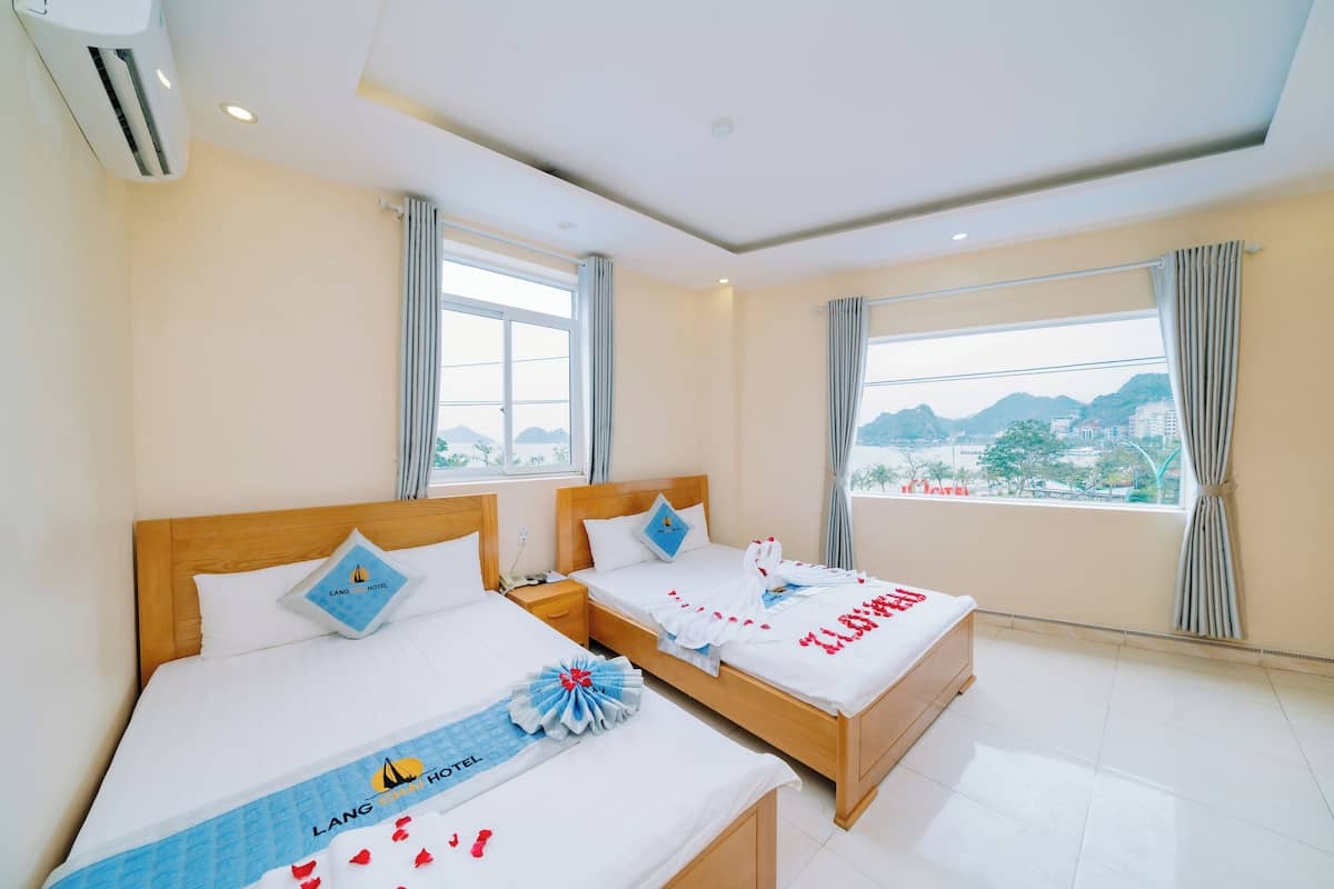 Deluxe Triple Room, 1 Bedroom, Sea View | Minibar, desk, blackout drapes, soundproofing