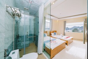 Deluxe Triple Room, 1 Bedroom, Sea View | Minibar, desk, blackout curtains, soundproofing - Lang Chai Hotel (Hai Phong)