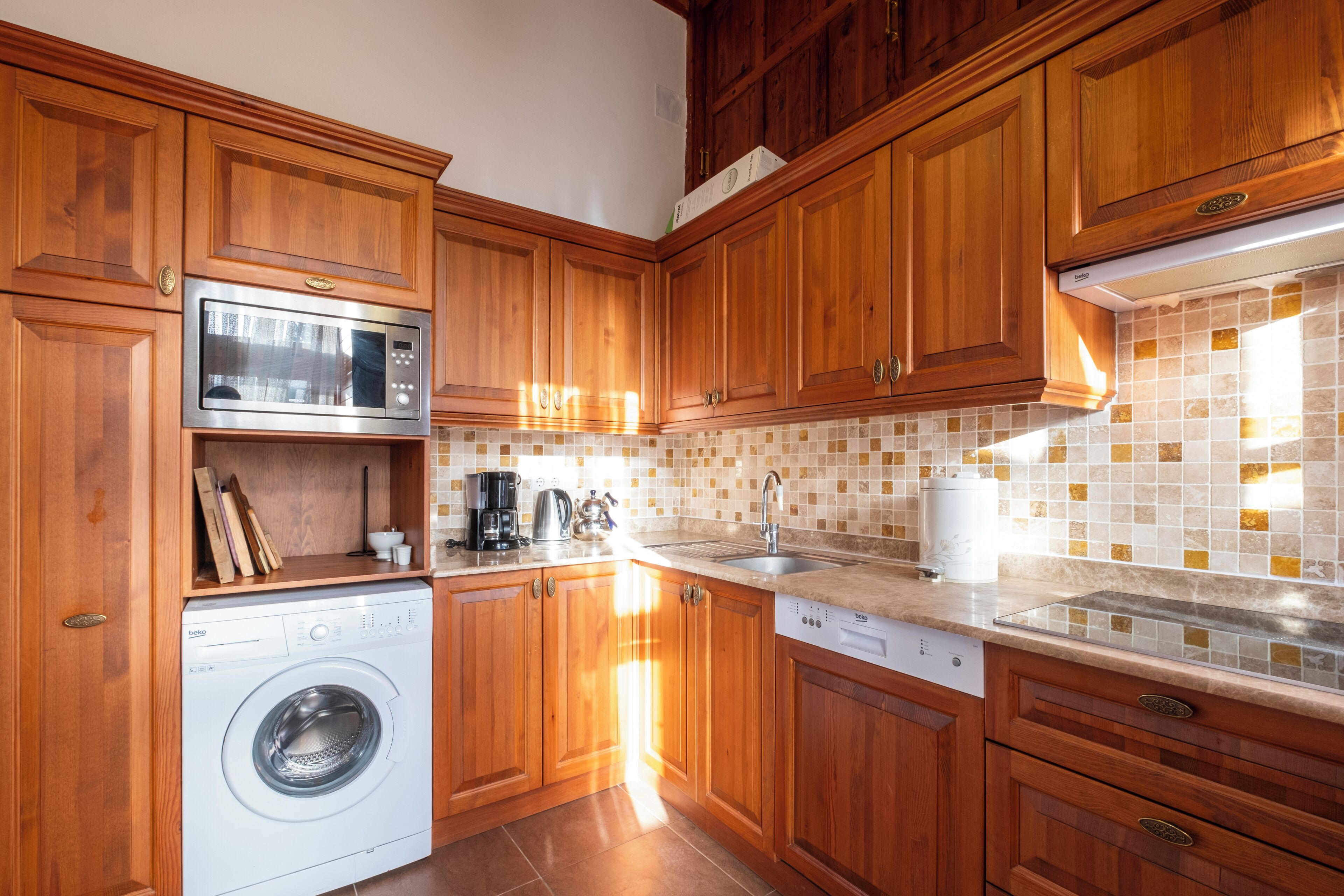 family condo, 2 bedrooms, sea view, courtyard area | private kitchen | mini-fridge, coffee/tea maker, electric kettle