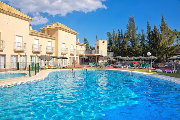 Indoor pool, seasonal outdoor pool, pool umbrellas, pool loungers