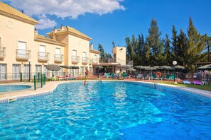 Indoor pool, seasonal outdoor pool, pool umbrellas, pool loungers