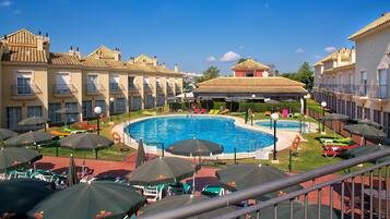 Indoor pool, seasonal outdoor pool, pool umbrellas, pool loungers