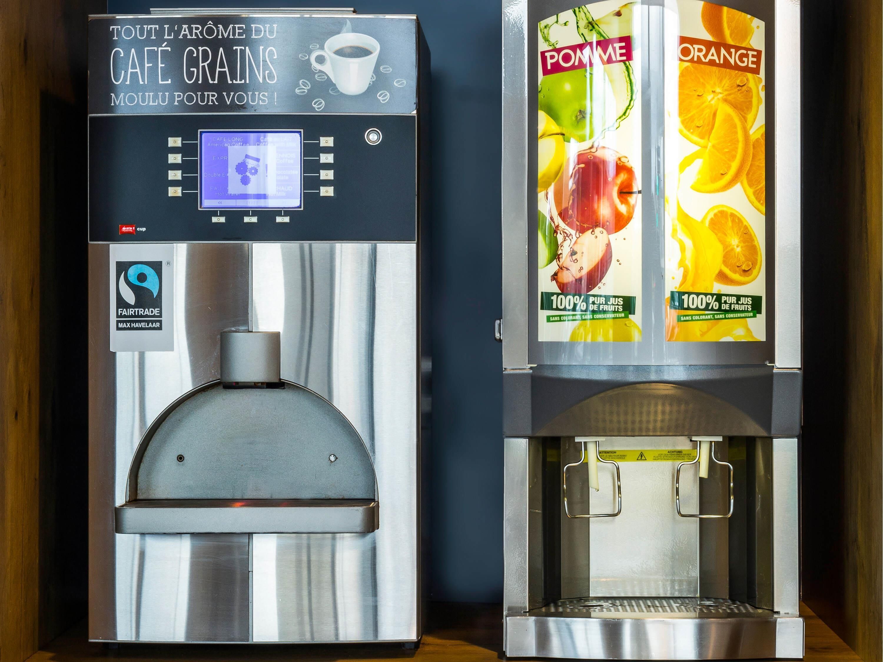 Two beverage dispensers, one for coffee and one for fruit juices, with a Fairtrade logo and a digital display.