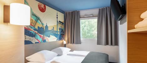 Desk, blackout drapes, soundproofing, free WiFi