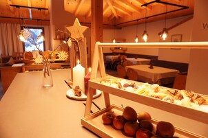 A buffet setup with a variety of desserts and fruits.