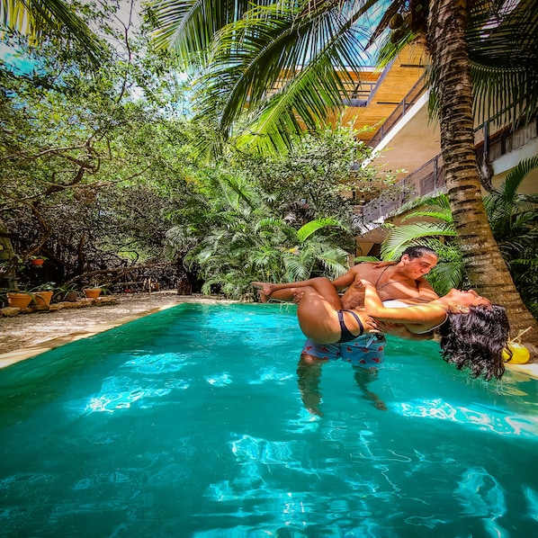 Outdoor pool, open 7:00 AM to 11:00 PM, pool umbrellas, sun loungers