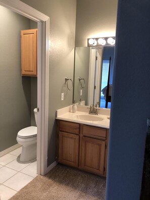 Combined shower/tub, hair dryer, towels, soap