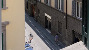 A multi-story building with uniform window shutters and a clean facade. - I FRAGOLI A SANTA CROCE (Firenze)