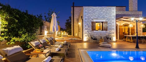 A heated pool, pool loungers
