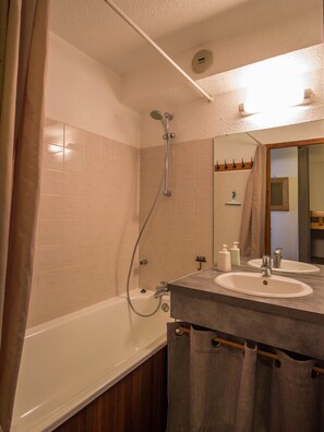 Combined shower/tub, hair dryer, towels, soap