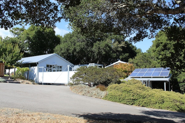 Courtyard entrance and carport under solar panels