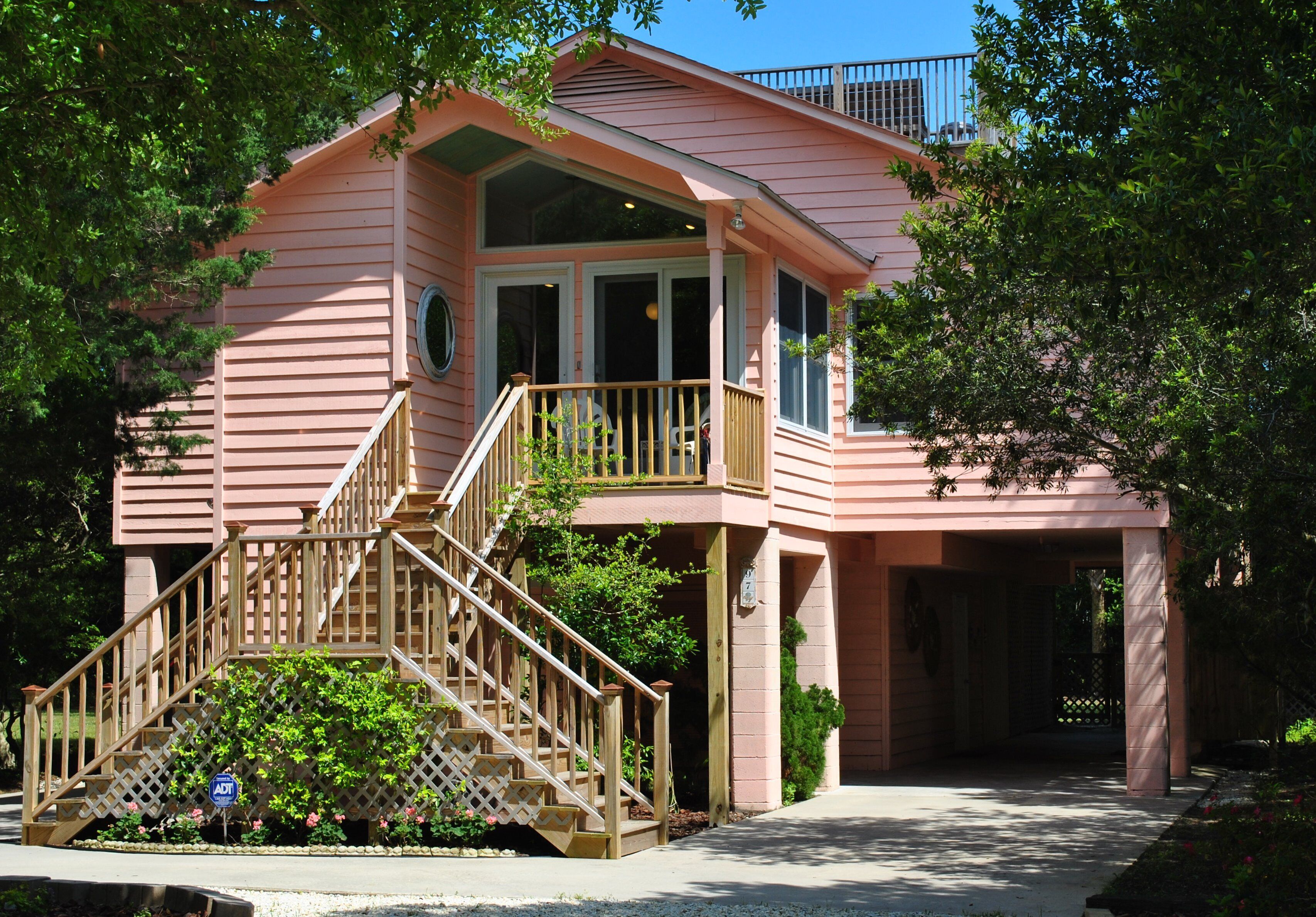 Home with screened porch, decks, crow's nest & private pool located at North Litchfield Beach.