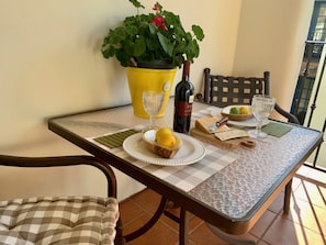 Enjoy a romantic dinner for two in this cozy dining area with a beautifully set table.