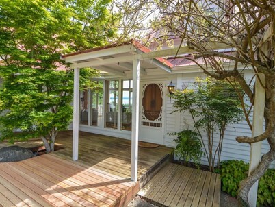 Charming waterfront 4 br gated estate on 8 acres with private beach and buoy.