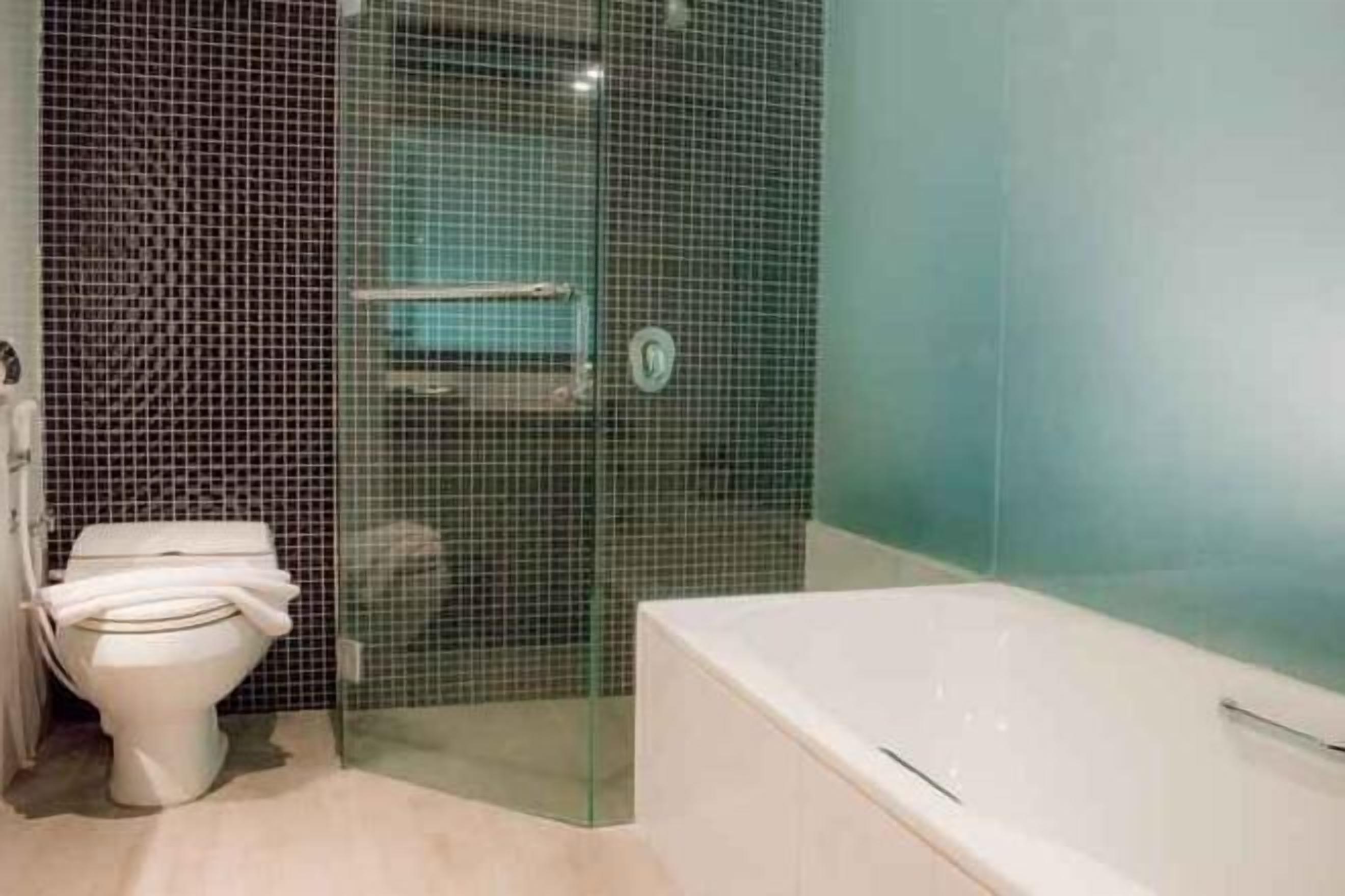 Bathroom | Shower, free toiletries, slippers, towels