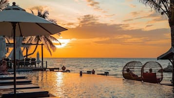 Outdoor pool, pool umbrellas, sun loungers