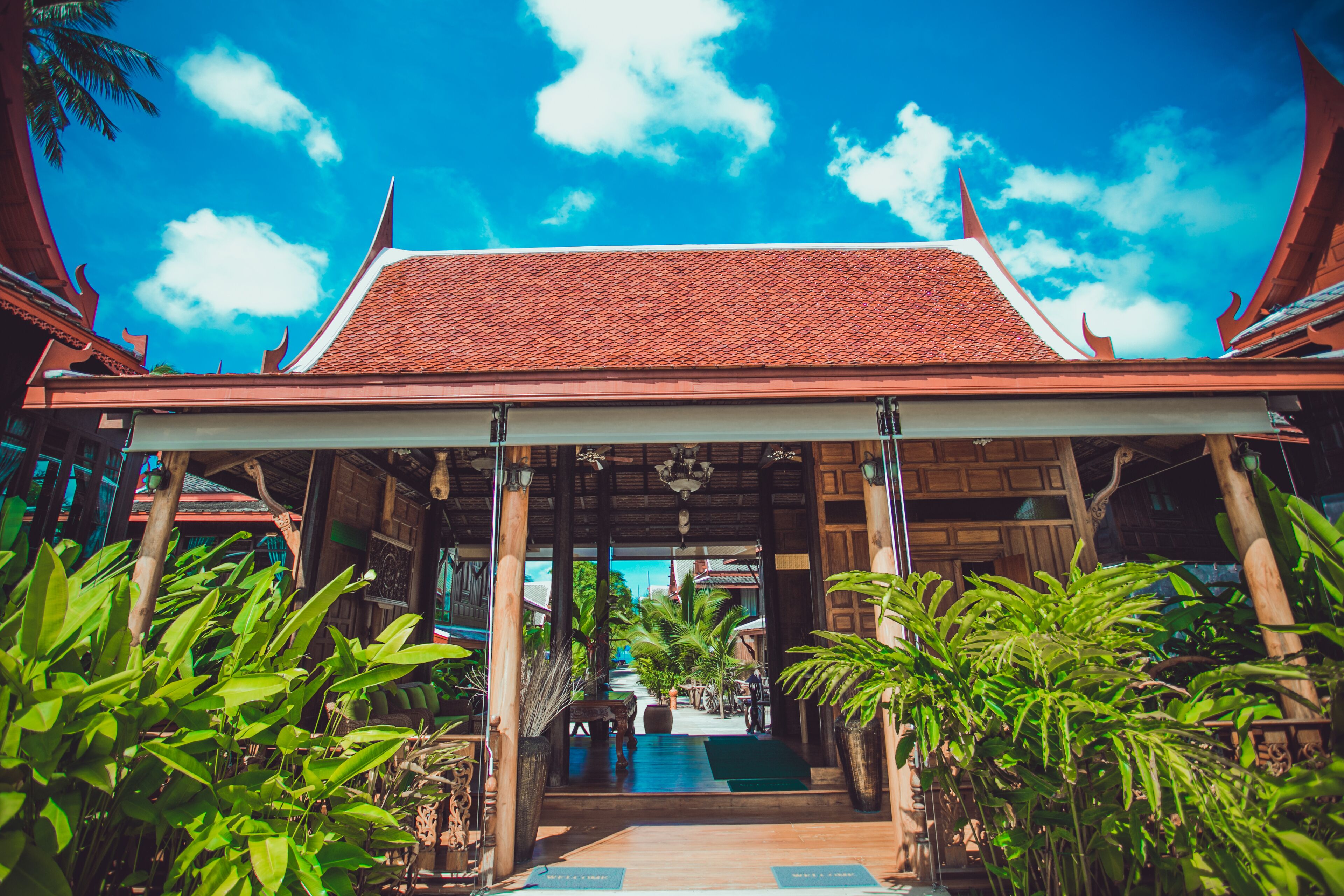A traditional building with a tiled roof and a covered entrance.