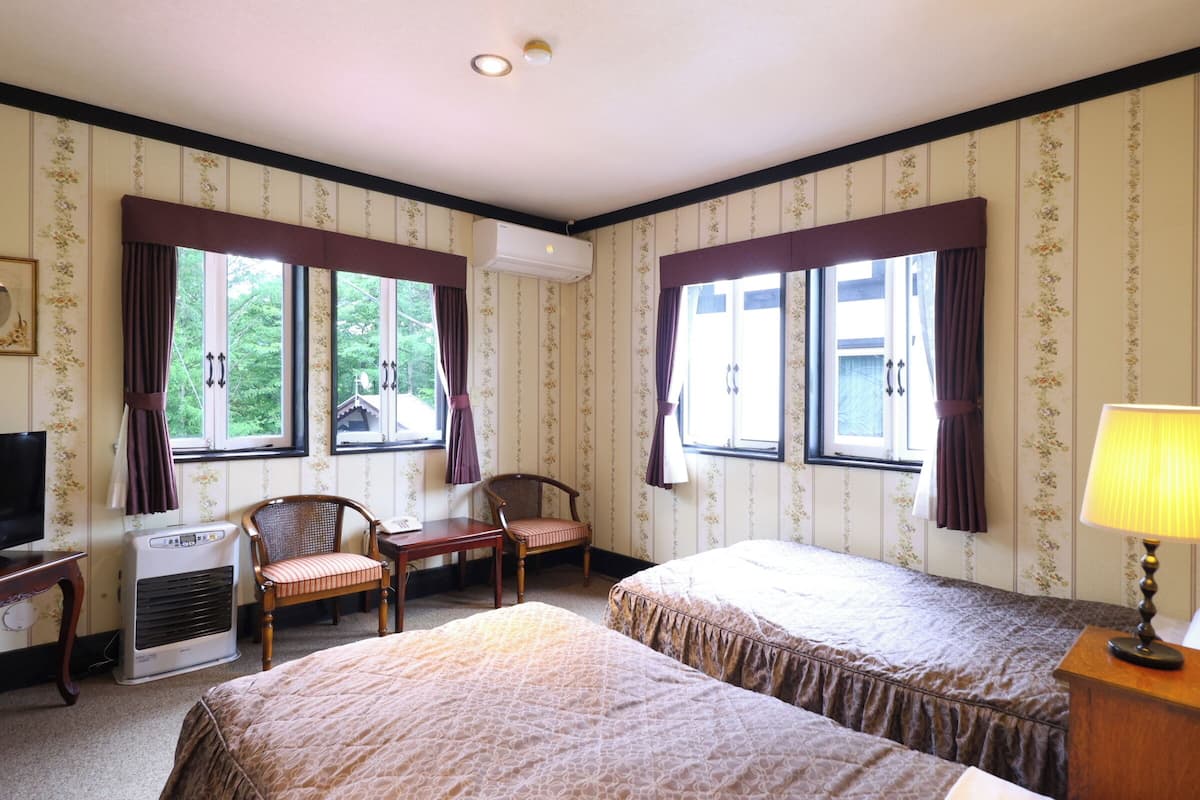 Chambre supérieure avec lits jumeaux | 1 chambre, literie de qualité, couette en duvet, ameublement unique