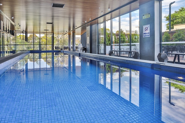 Indoor pool, open 6:00 AM to 9:00 PM, pool loungers