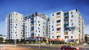 Experience the unique architectural design of this hotel, featuring a striking facade with geometric patterns and multiple balconies offering various room layouts and views.