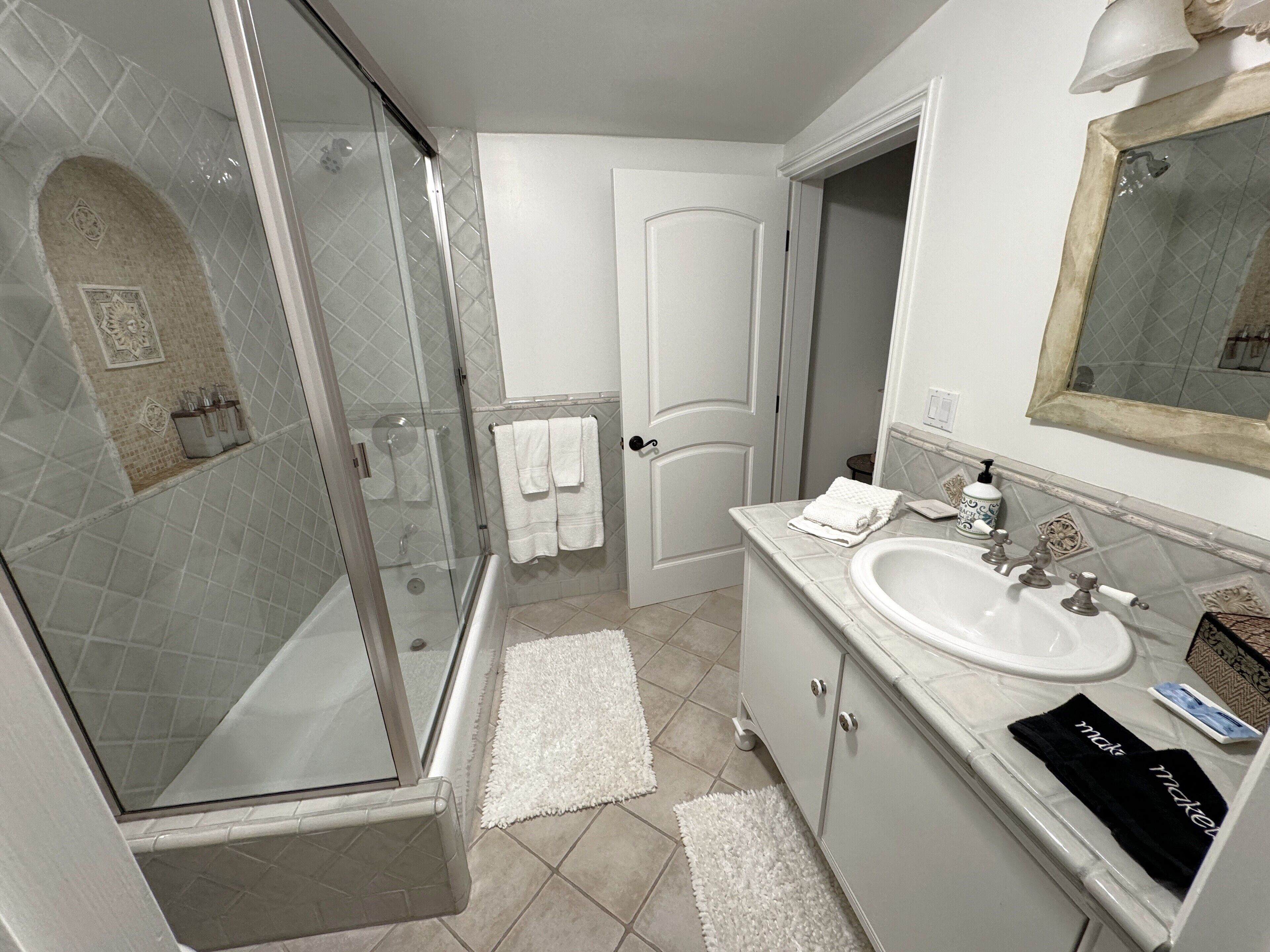 Bathtub, hair dryer, towels, soap