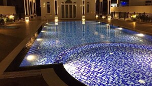 A swimming pool with mosaic tiles and a building in the background. - TOP#1 Experience Danang 'Casa de Tan 1' Pool Villa (Da Nang)