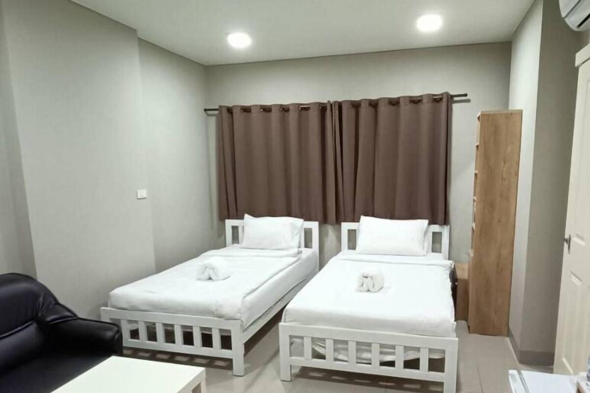 Desk, laptop workspace, bed sheets