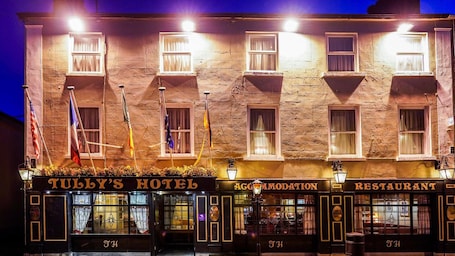 A building with three sections labeled 'TULY'S HOTEL', 'AGGREGATION', and 'RESTAURANT'.