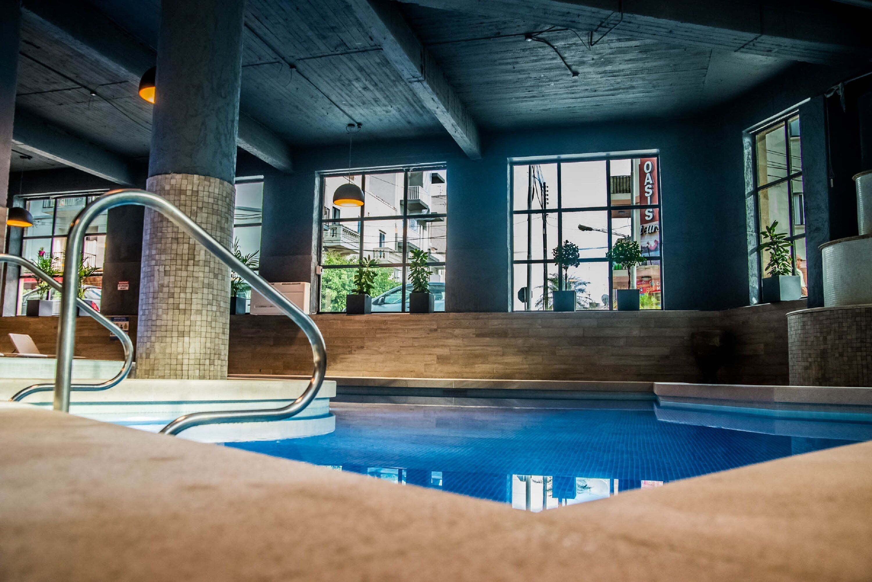 indoor pool, outdoor pool, open 7:00 am to 7:00 pm, pool umbrellas