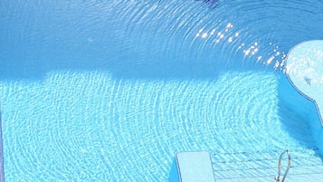 Indoor pool, outdoor pool, open 7:00 AM to 7:00 PM, pool umbrellas