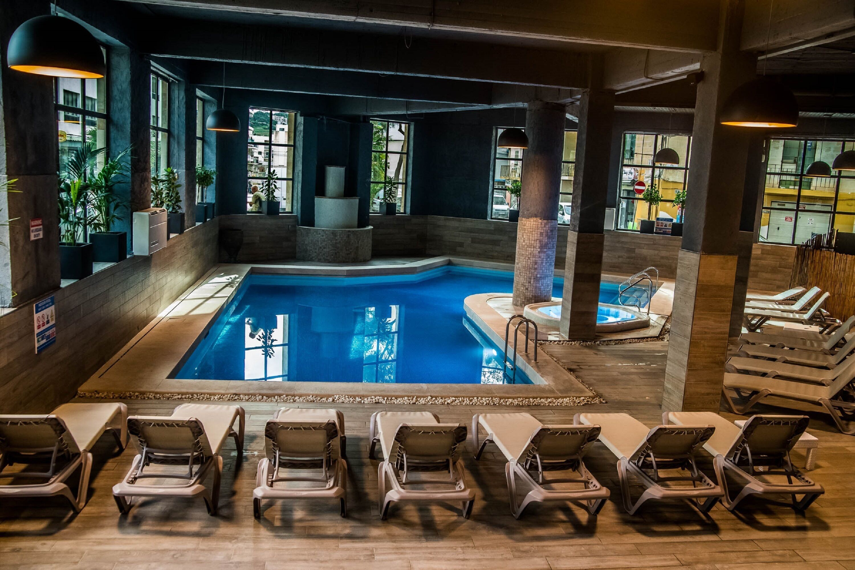 indoor pool, outdoor pool, open 7:00 am to 7:00 pm, pool umbrellas