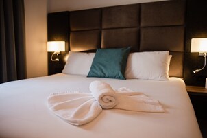 Premium bedding, memory-foam beds, in-room safe, desk