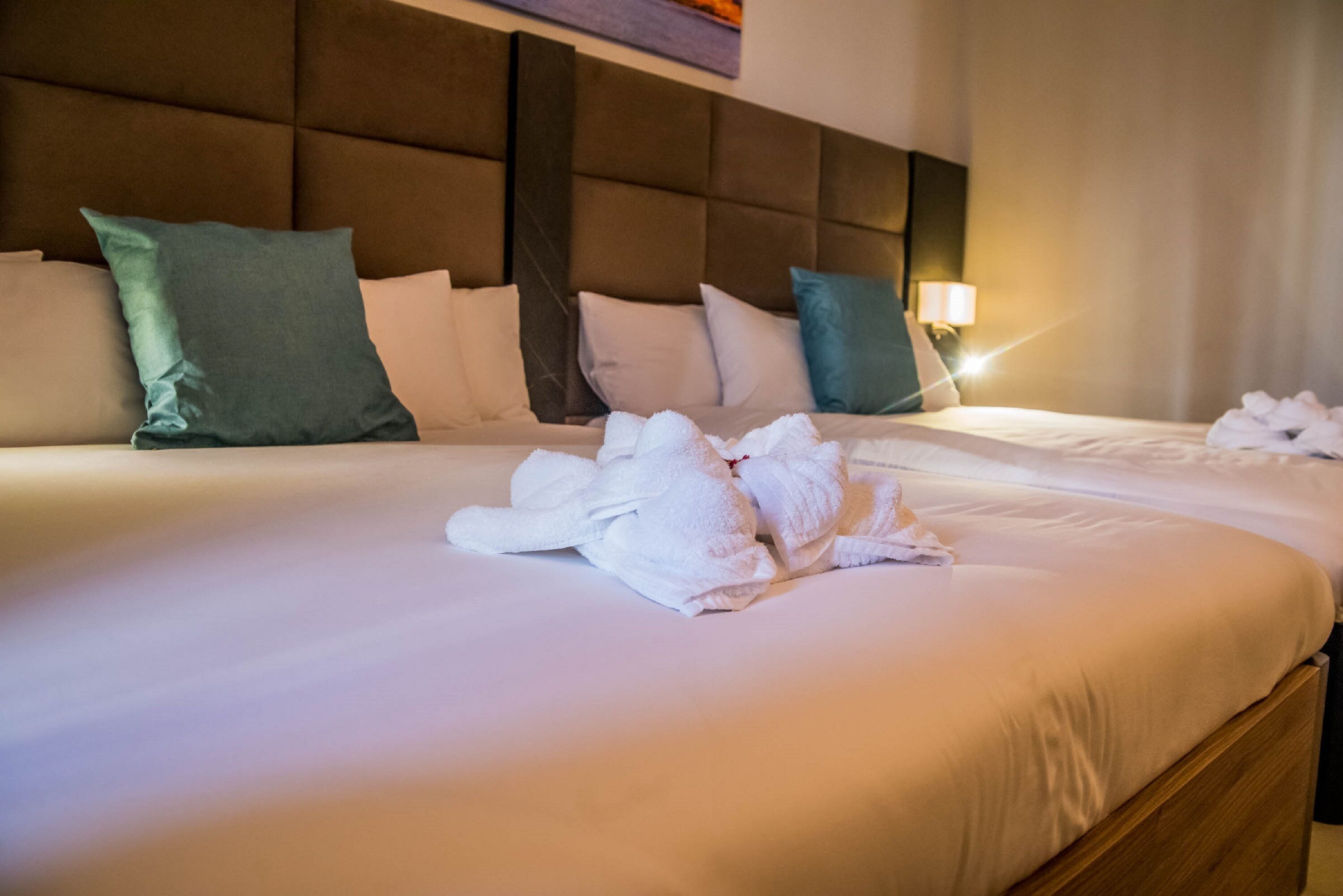 family room, balcony, city view | premium bedding, memory-foam beds, in-room safe, individually decorated