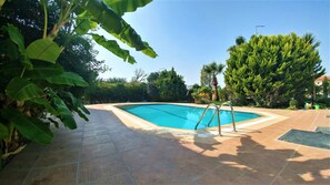 Outdoor pool, pool umbrellas, pool loungers
